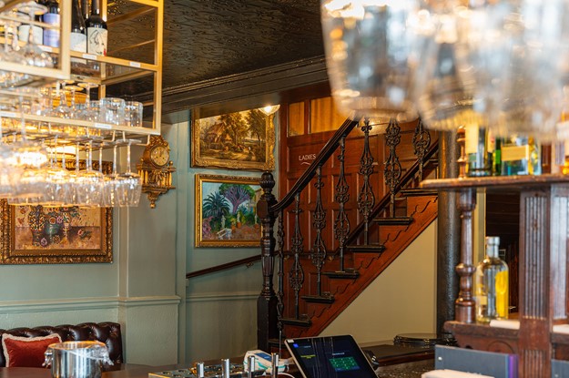 the rugby tavern staircase and oil paintings 
