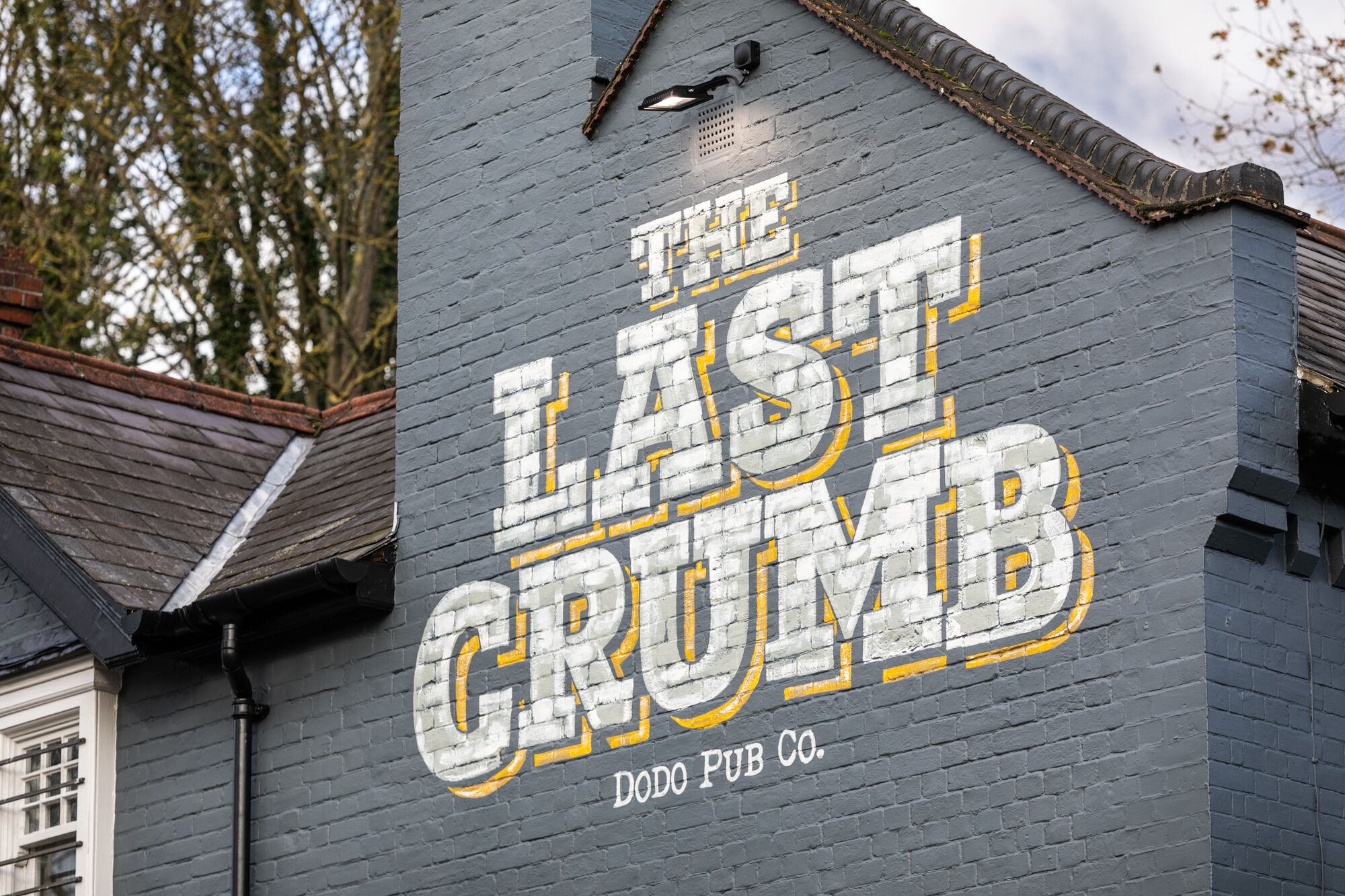 pub sign writing at the last crumb