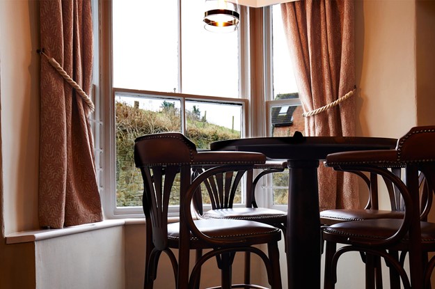 seating by a window in a pub