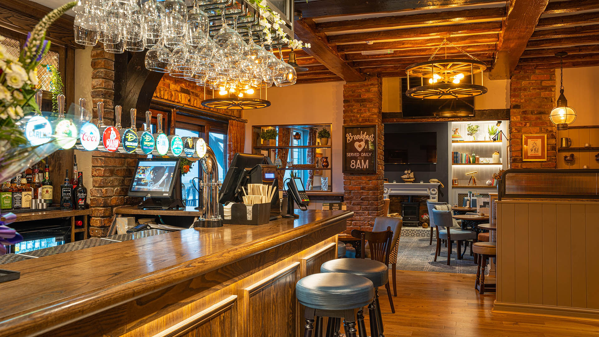 Pub with wooden bar and blue bar stools