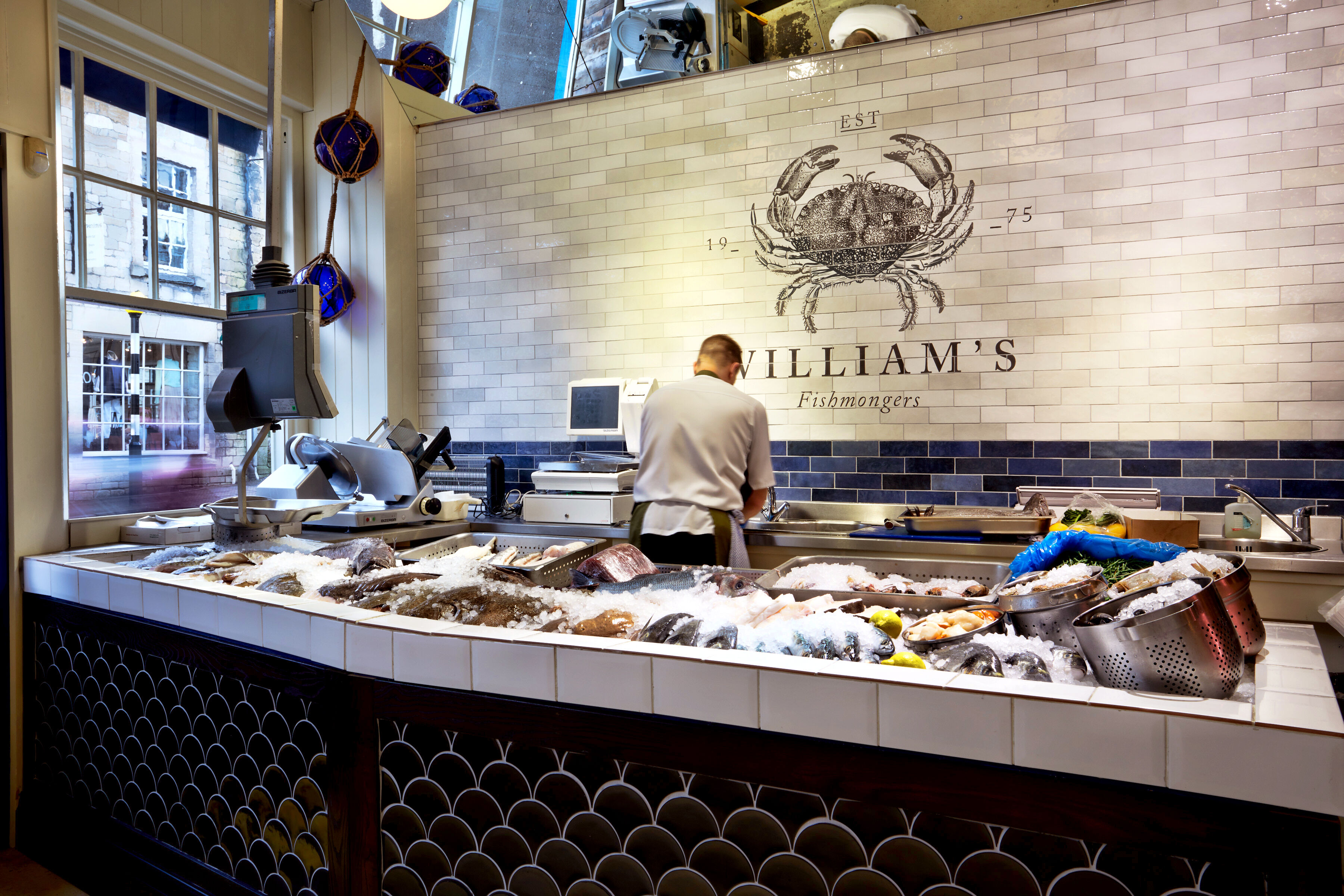 The refurbished William's food hall featuring the fishmonger counter before and after the fit-out