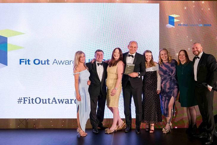 The team being awarded the award on stage