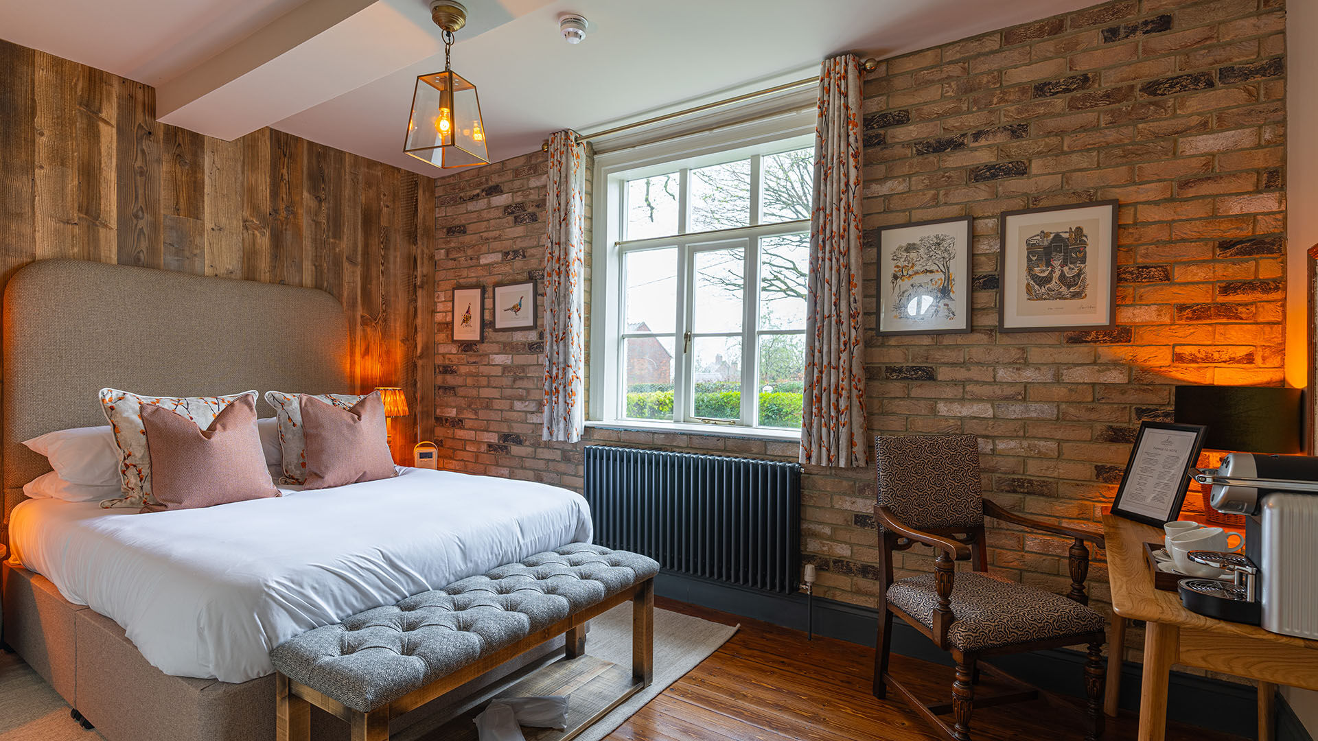 Bedroom with green wall and artwork