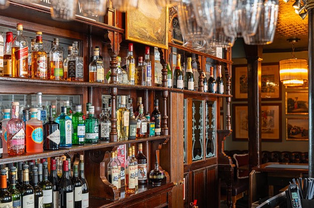 the rugby tavern back bar with spirits