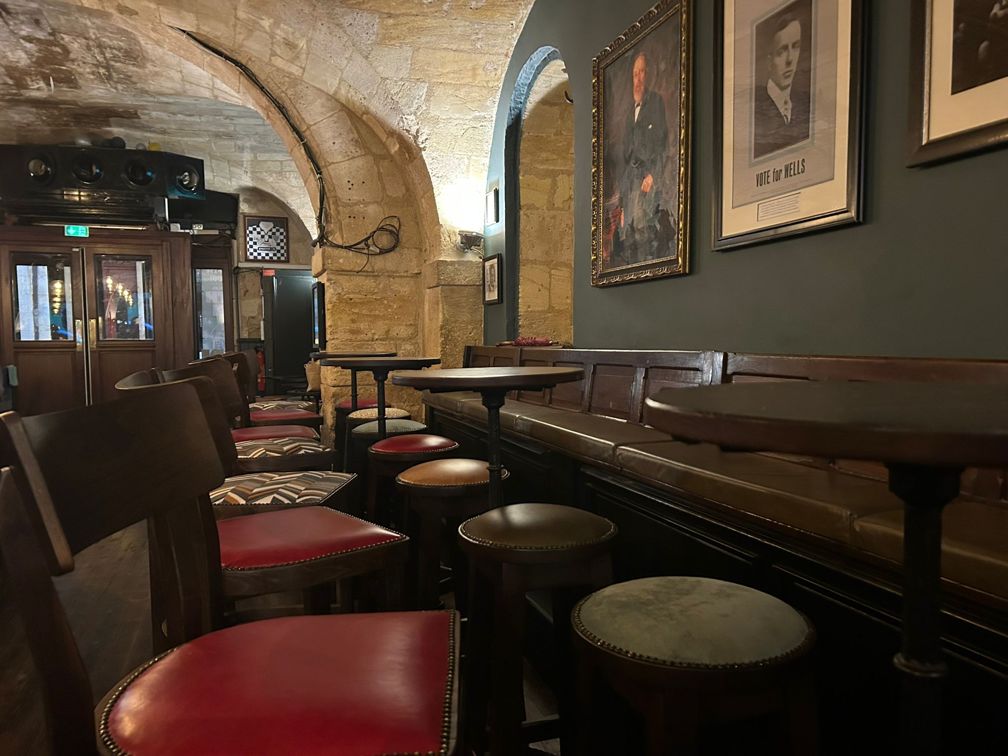 Inside the pub, red bar stools