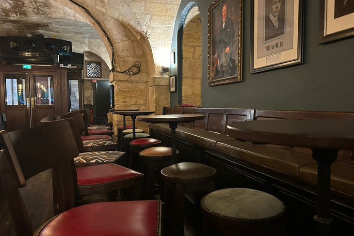 Inside the pub, red bar stools