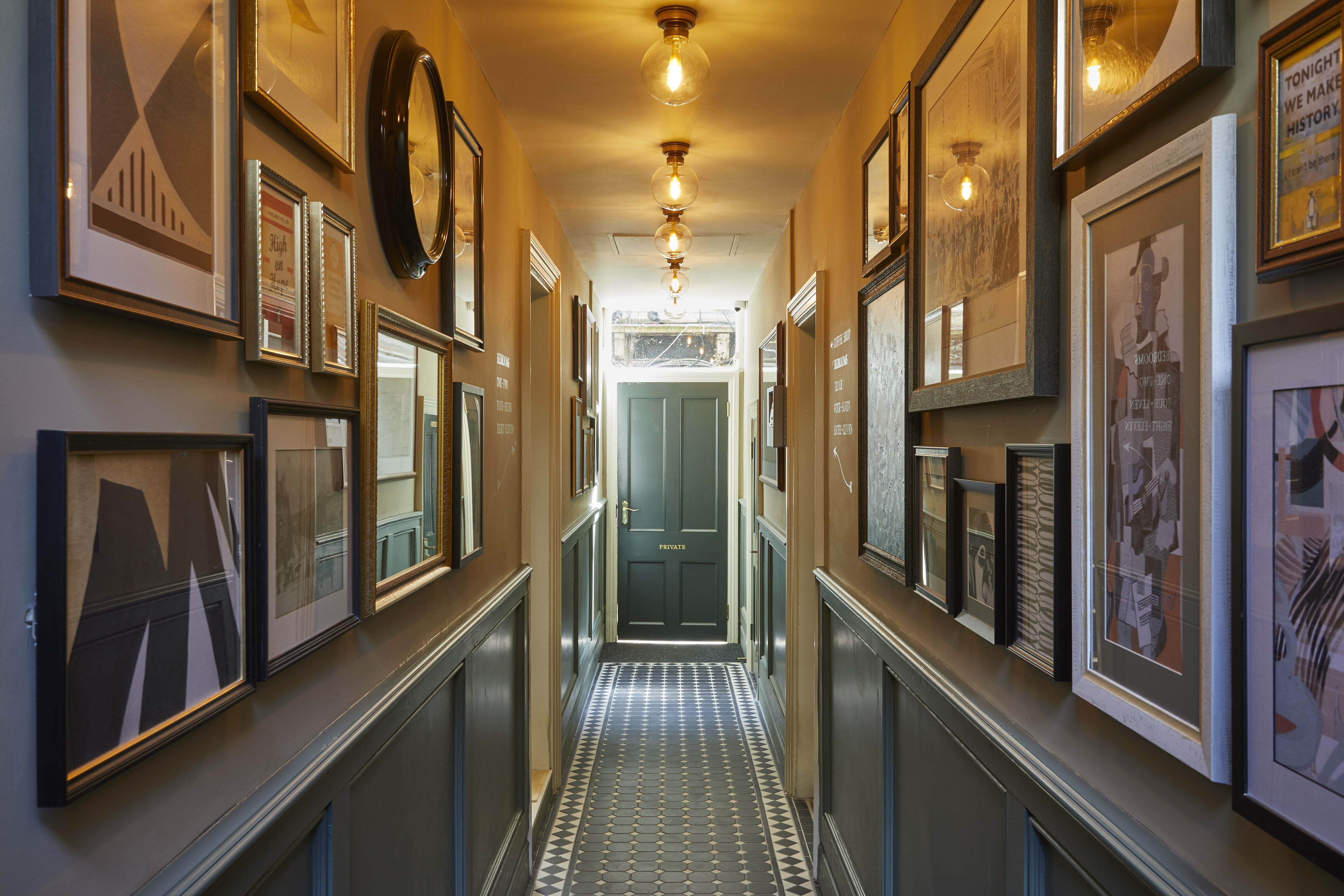 corridor with hanging pictures
