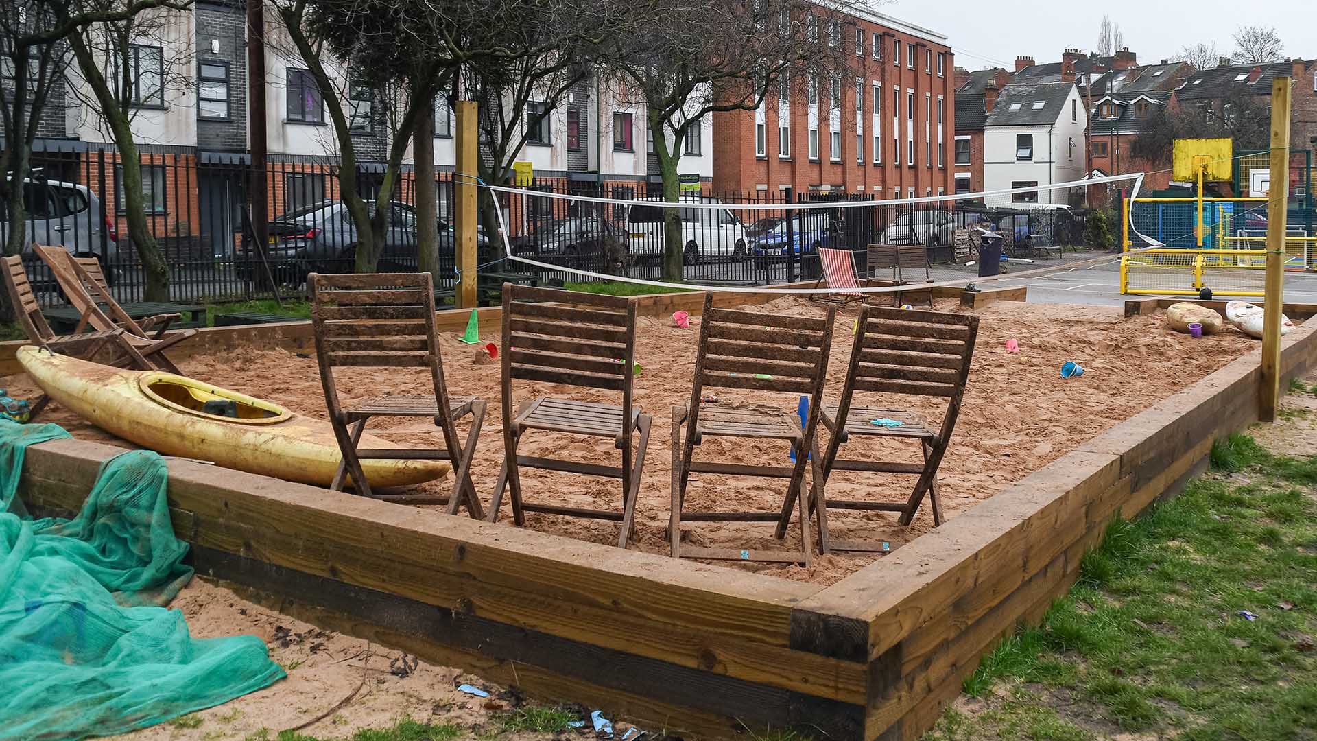 Wooden chairs in sandpit