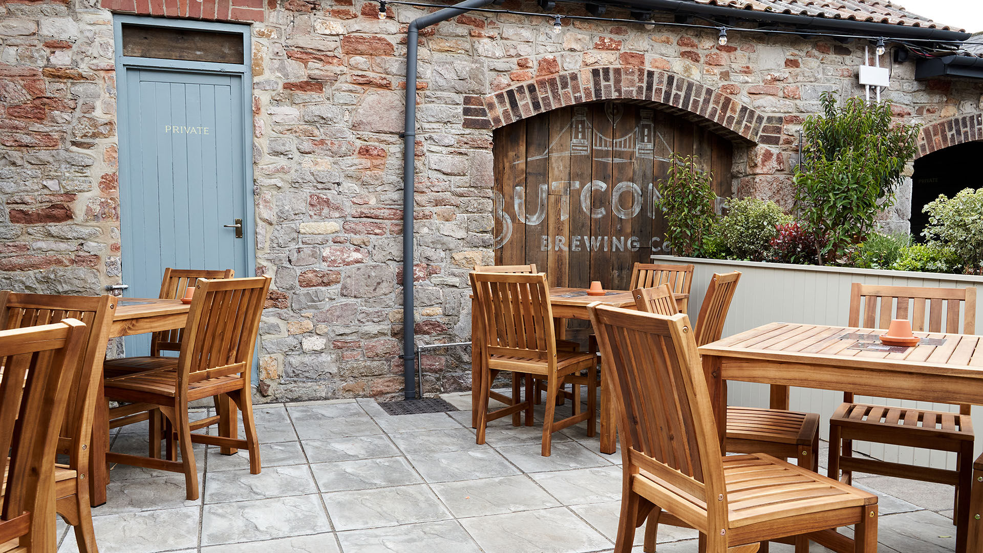 Interior dining area after the fit-out with red lampshade and seating
