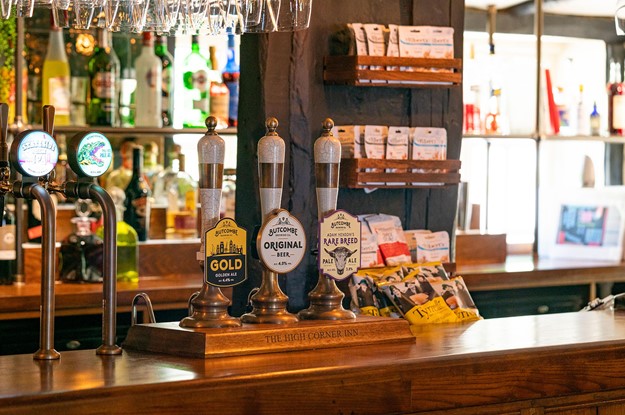 wooden bar top with butcombe ales 