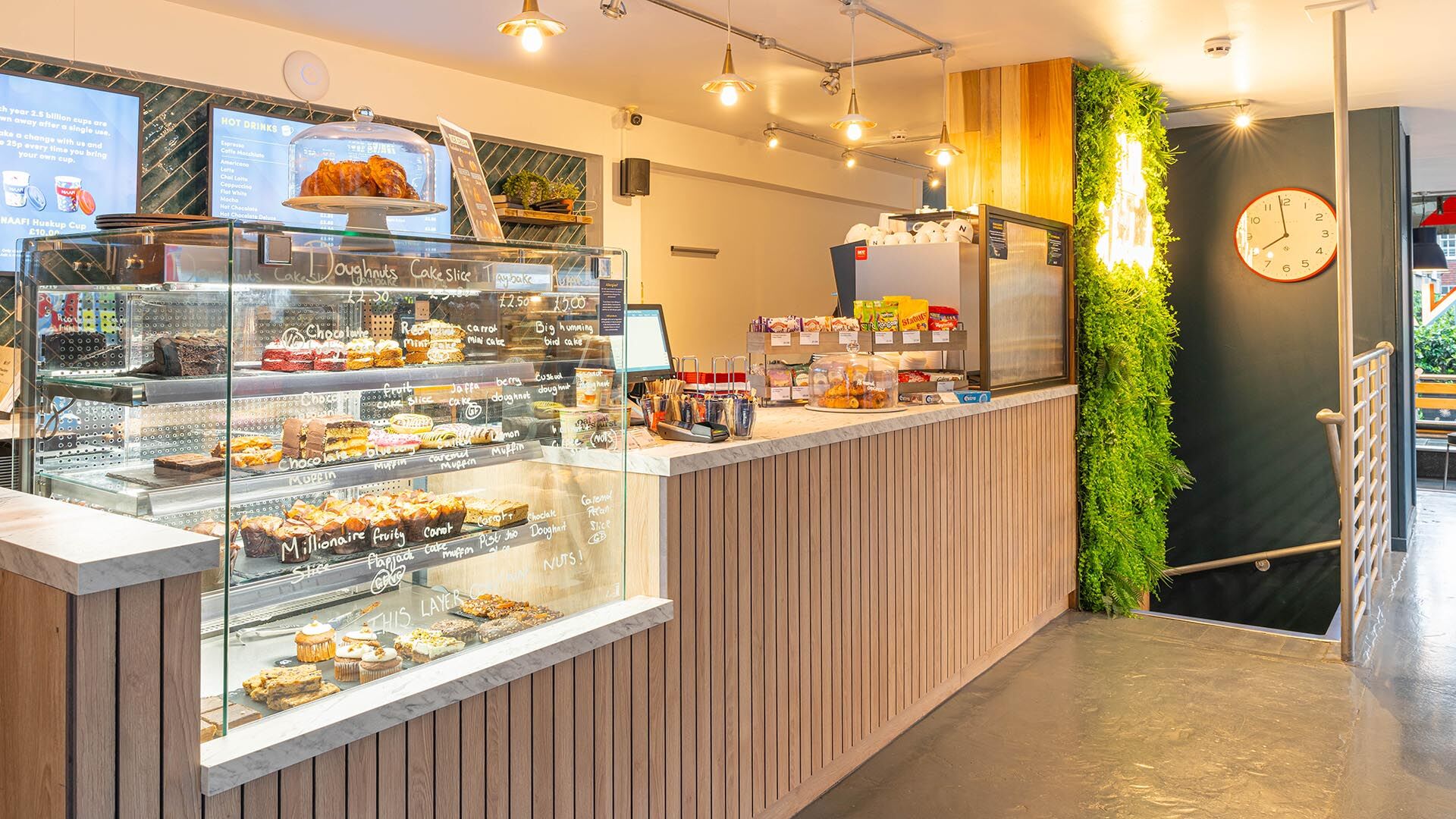 Naafi Winchester cafe serving counter front with cake fridge