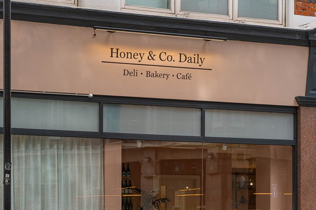 honey and co daily bakery front with signage
