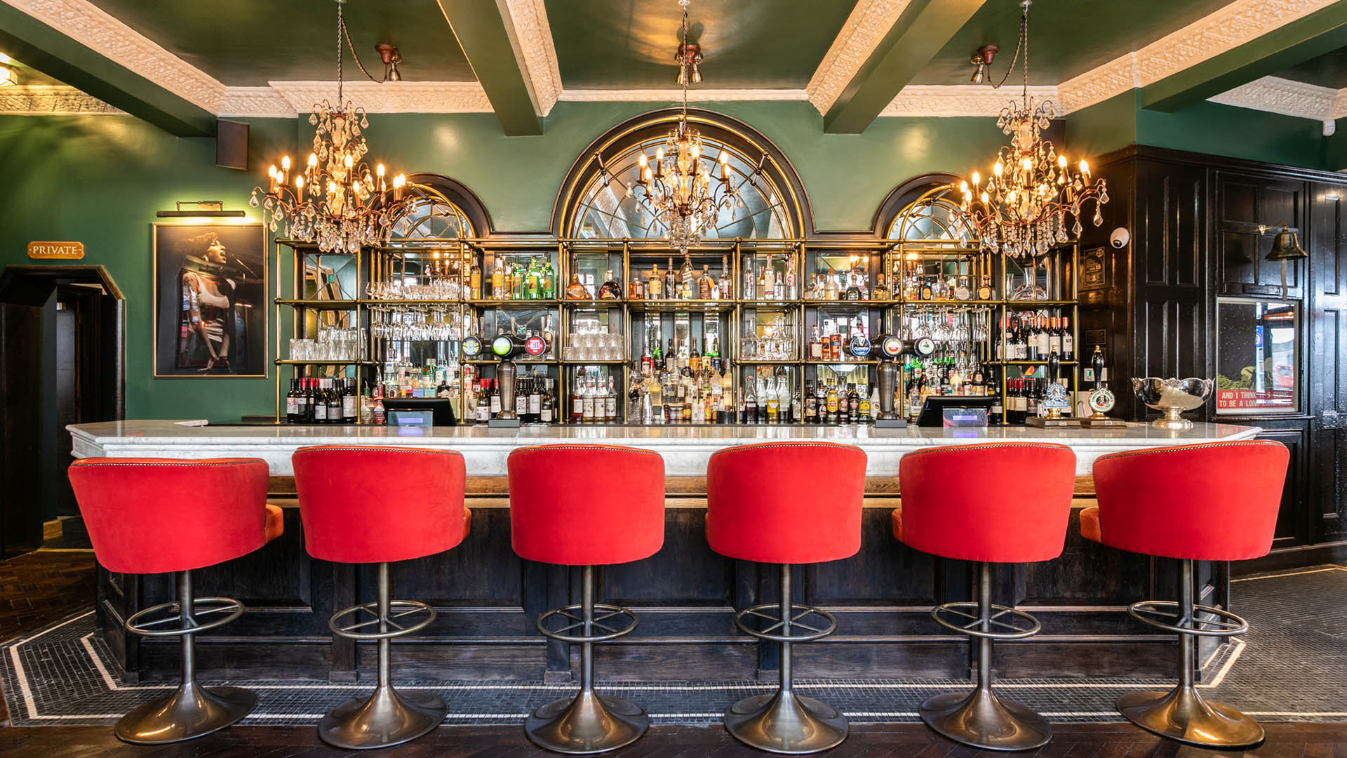 bar with red high stools
