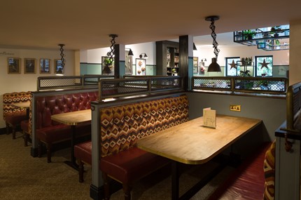 crown & cushion seating at the pub bar