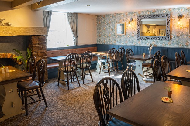 Black swan pub with chairs and tables