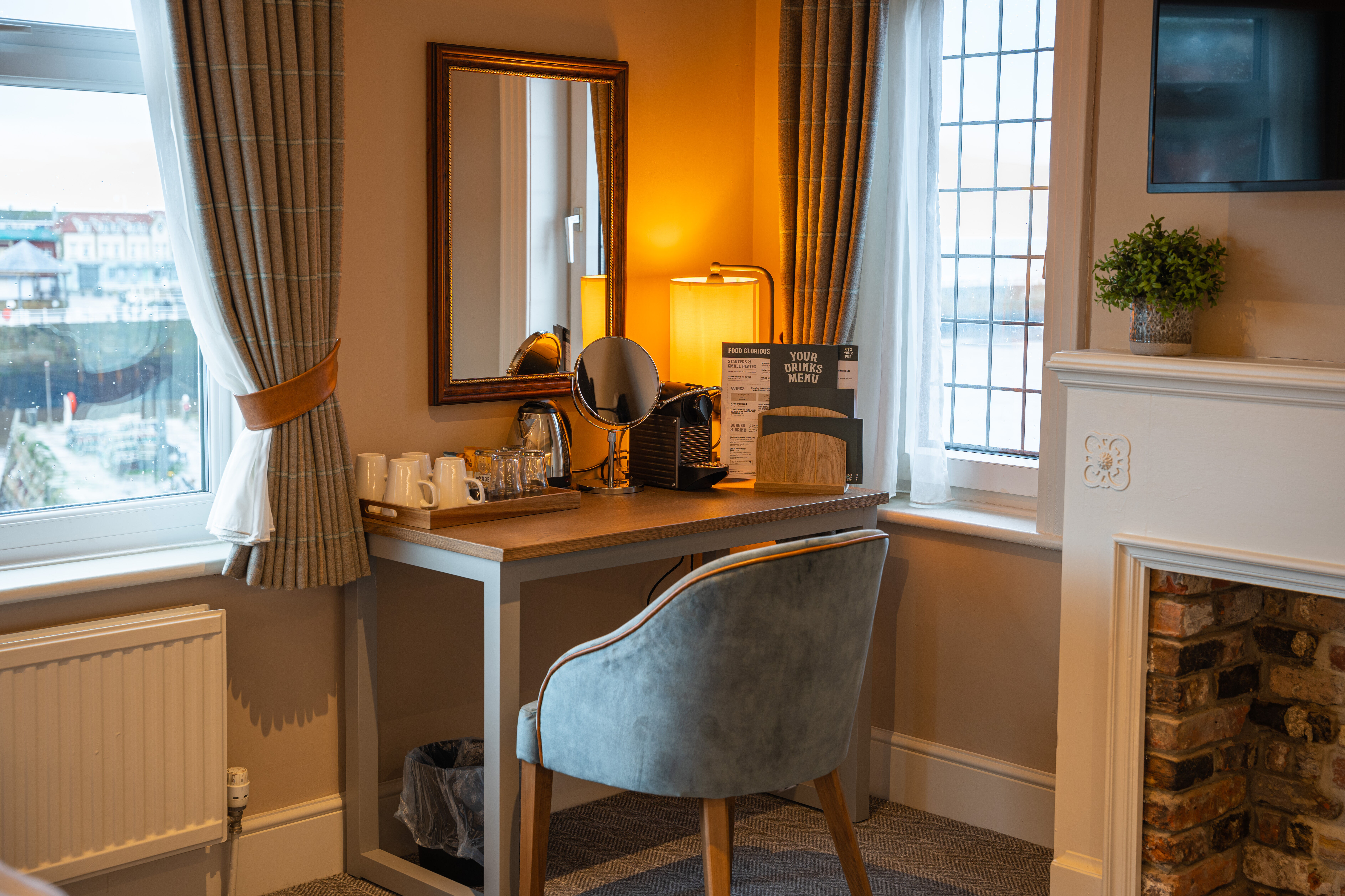 Bedroom with green wall and artwork