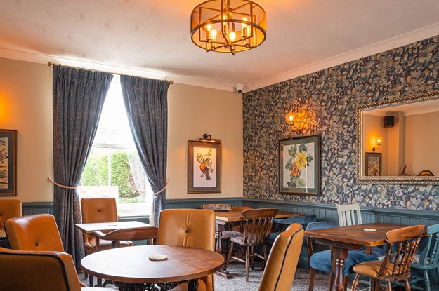 pub dining area with patterned wall paper
