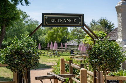 Entrance sign to pub garden