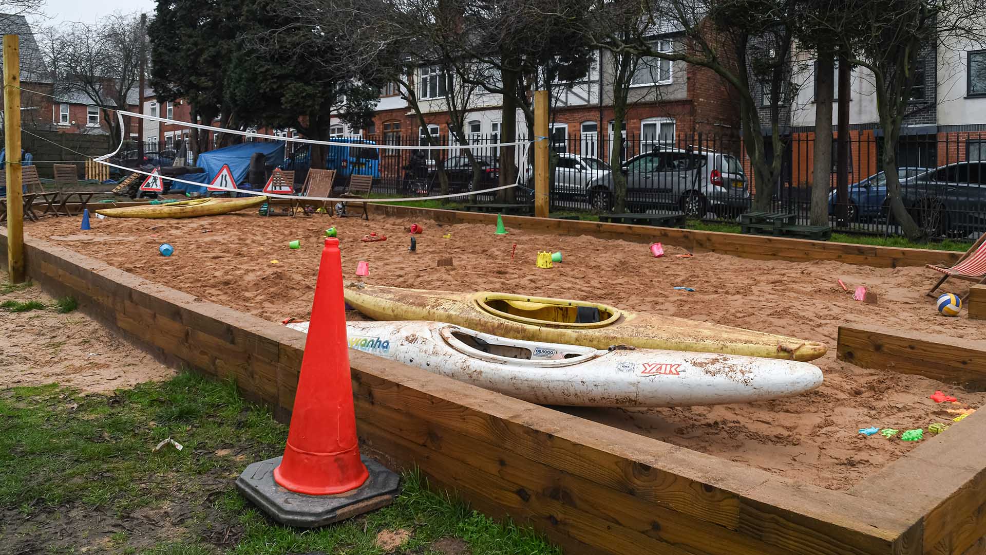 Sandpit items such as kayak and traffic cone