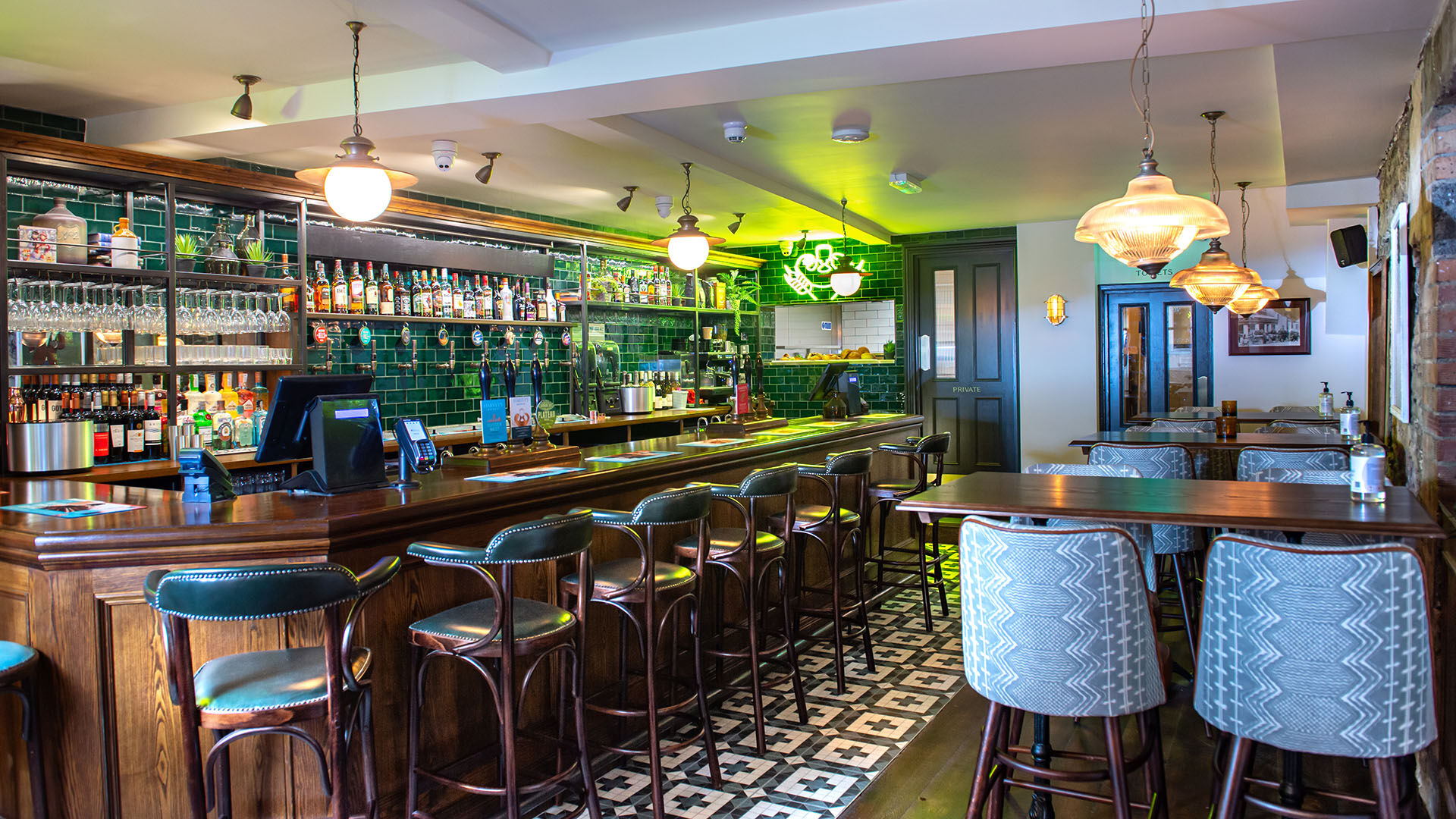 Neon sign behind a bar